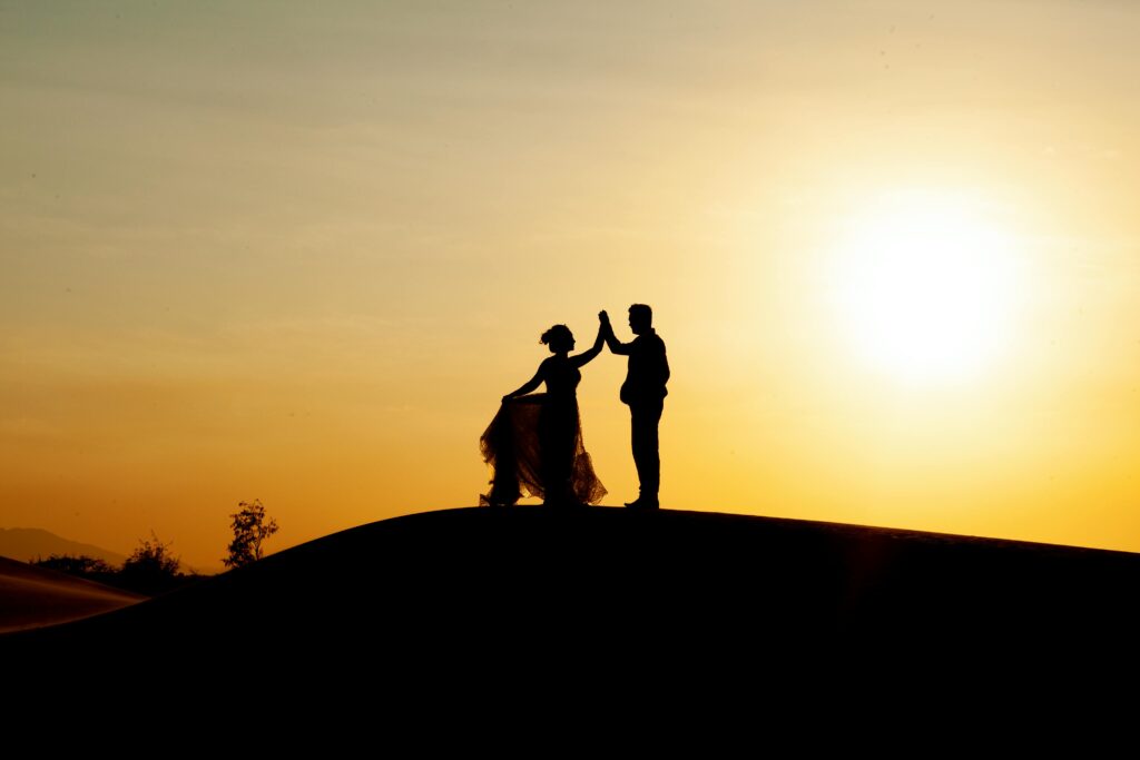 pexels photo 3998365 3998365 Silhouetted couple dancing on the beach during a golden sunset, creating a romantic scene.